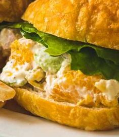 a chicken salad sandwich with lettuce and cheese