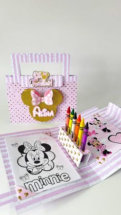 a minnie mouse birthday card with crayons and markers