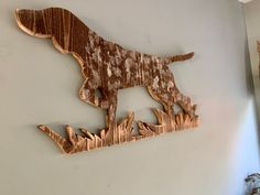 a metal dog is mounted on the wall