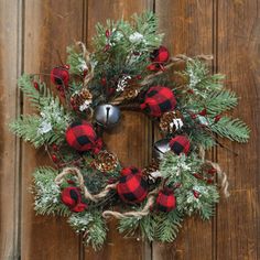 Strike a balance between rustic and modern with our Buffalo Gingham Country Holiday Wreath, 12"! Featuring a silver jingle bell, red pips, jute string, pine cones, red and black buffalo check ornaments, and lightly flocked evergreen branches this wreath has everything needed for a cozy holiday look. Inside diameter is 3.5", outside is approximately 12" - 14". The Holiday Aisle® | The Holiday Aisle® Buffalo Gingham Country Holiday Wreath 13.0 H x 2.5 W x 13.0 D in brown / green / redWood / Twig i Winter Display, Buffalo Check Fabric, Front Door Christmas Decorations, Country Holiday, Rag Wreath, Holiday Wreath, Winter Home Decor, Jute Rope, Handmade Wreaths