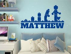 a bedroom with a wall decal that says,'i love mathew '