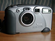 a camera sitting on top of a wooden table