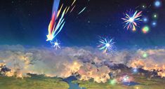 fireworks in the night sky above clouds and water with bright colored lights coming from them