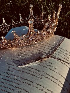 a tiara sitting on top of an open book