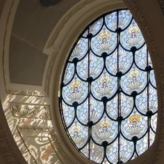 the inside of a building with a round window