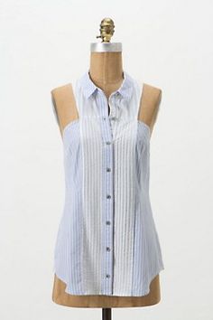 a mannequin wearing a blue and white striped shirt