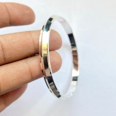 Name Of Product:- 925 Sterling Silver Kada Material: Silver Size & Weight: 2.2 - 21 grams 2.4 - 22.50 grams 2.6 - 23.50 grams To measure the size of the bangle: Hold your hand as if you were putting on a kada. Bring all of your fingers together with your thumb and little finger touching. Measure around the hand at the widest point with a tape measure or a strip of paper. Be sure to pull the paper or tape measure snug against your skin. Mark the paper with a pen and measure it with a ruler. T Silver Bangle With Sterling Silver Clasp, Silver Bangle Stamped 925, Sterling Silver Bracelet With Shiny Finish, Silver Sterling Bangle, Silver Sterling Silver Bangle, Minimalist Hallmarked Silver Bracelets, Silver 925 Stamped Bangle Jewelry, Silver 925 Stamped Bangle, Silver Bangle With Polished Finish