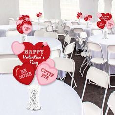 valentine's day decorations are arranged on tables and chairs