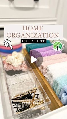 an organized drawer with folded towels and other items in the bottom drawer, labeled home organization dollar tree