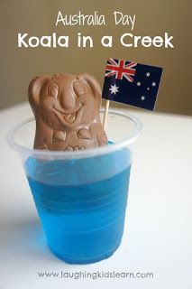 there is a plastic cup with an elephant in it and the words australia day koala in a creek