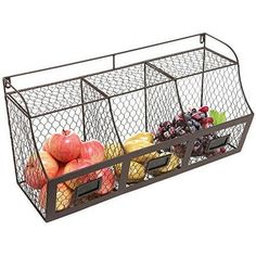 a metal basket filled with fruits and vegetables