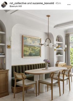 the dining room table is surrounded by built in bookshelves