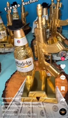 a table topped with bottles of alcohol and gold decorations