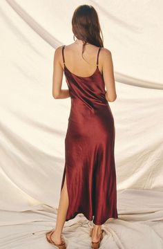 Indulge in luxurious elegance with our Reflection Burgundy Dress. Inspired by 90s fashion, this slip-on midi dress boasts a sophisticated cowl neck design that exudes effortless style. Perfect for any occasion, this dress will make you stand out with its timeless beauty. Stacked Jewelry, Burgundy Dress, Satin Slip, Satin Slip Dress, Dress Jewelry, Fall Dresses, Dress Materials, 90s Fashion, Neck Designs