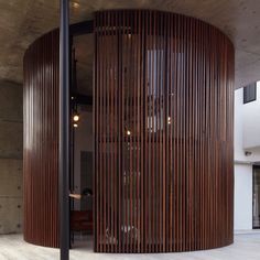 the circular room has wooden slats on it