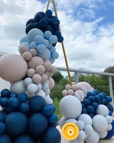 blue and white balloons are stacked on top of each other