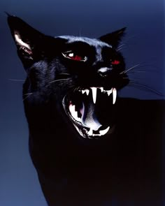 a black cat with its mouth open and it's teeth wide open showing red eyes