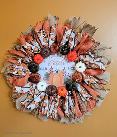 a fall wreath hanging on the wall