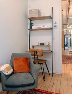 a living room filled with furniture and shelves