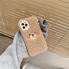 a cell phone case with a bear on it