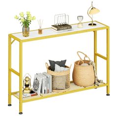 a yellow table with baskets and books on it