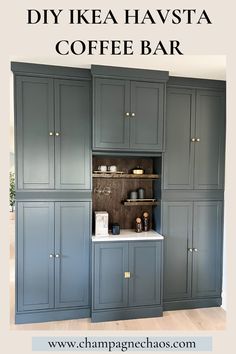 a kitchen with gray cabinets and white counter tops in the center is an open pantry