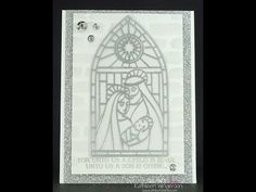 a card with a stained glass window and the words for unto us a child is born