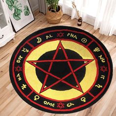 a black and red rug with a pentagram star on it