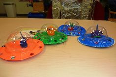 three different colored plates sitting on top of a table