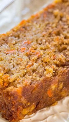 a loaf of carrot bread sitting on top of a white plate