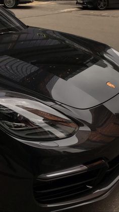 a black sports car parked on the street