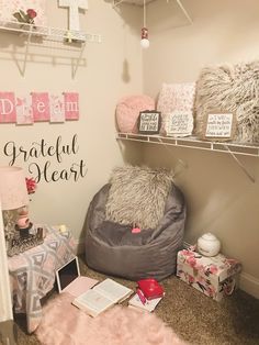 a room filled with lots of furniture and decor on shelves next to a wall that says grateful heart