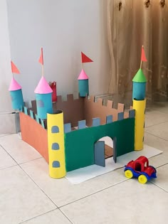 a castle made out of cardboard sitting on the floor