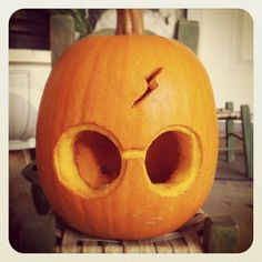 an image of a pumpkin with glasses on it's face and the caption harry potter pumpkin carving by my sister karna