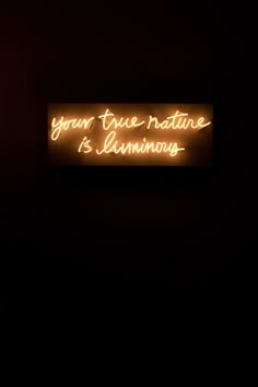 a neon sign that says your true nature is luminous