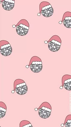 a pink background with many different hats on top of each other and one is wearing a santa hat