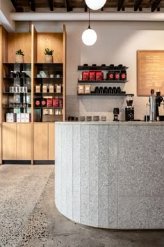 a coffee shop with marble counter tops and shelves