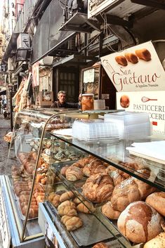 a bakery with breads and pastries on display