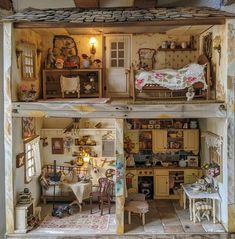 a doll house with furniture and accessories in it