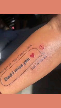 a person with a tattoo on their arm that says, dad i miss you and not allowed