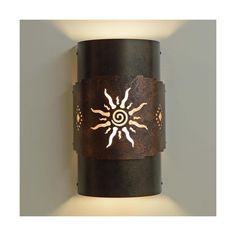 a light that is on the side of a wall with a sun and moon design