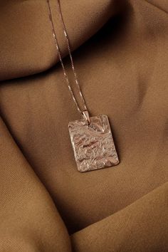 Large rose gold pendant necklace, Big square pendant large Square medallion necklace, Rectangular necklace Chunky pendant, Charm necklace  Charm necklace with a textured rectangle pendant. The pendant has a sculptural look - the making process results every time with a different pattern so every pendant is unique.  Size XL For other sizes/models/complete sets explore further in the section "Minimal necklaces" in our shop: https://www.etsy.com/shop/MairBerlin?ref=seller-platform-mcnav&section_id= Luxury Handmade Necklace With Square Pendant, Luxury Necklace With Large Square Pendant, Luxury Drop Necklace With Large Pendant, Luxury Necklace With Large Pendant For Gift, Luxury Rectangular Pendant Necklace For Anniversary, Cheap Rectangular Necklace For Birthday Gift, Luxury Minimalist Square Necklace, Cheap Personalized Necklaces With Square Pendant, Cheap Metal Necklace With Rectangular Pendant