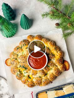 a pretzel with ketchup and mustard on it next to other food items