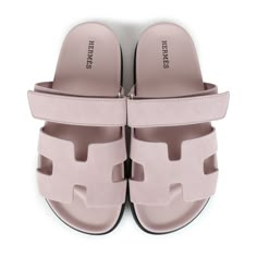 This pair of Chypre sandals are in Rose Porcelaine suede with a black rubber sole and feature the iconic H and a velcro crossover strap. Origin: ItalyCondition: New and never wornAccompanied by: Hermes box, dustbagsSize: 37 EU Luxury Designer Sandals For Work, Luxury Sport Sandals For Summer, Luxury Cushioned Sport Sandals For Women, Luxury Suede Sandals With Rubber Sole, Luxury Designer Sport Sandals For Summer, Hermes Cyprus Sandals, Hermes Figari Sandal, Hermes Takara Sandal, Hermes Sandals Pool