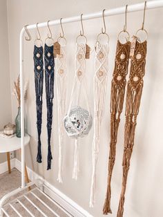 there are many different types of macrame hanging on the wall next to each other