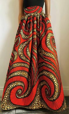 Handmade Unlined African Print Maxi / Full-Length Skirt     Elastic waistband skirt at the back     2 open side-entry pockets     Length: 46"     100% Wax Cotton     Handmade     Made in the UK (Colours may vary due to lighting on images. The product images are closest to the true colour of the product.) Long Skirt With Wide Waistband, Orange Full Maxi Skirt With Lined Skirt, Orange Skirt Bottoms With Pockets, Flowy Orange Maxi Skirt With Elastic Waistband, Long Red Skirt With Pockets, Red Full Skirt With Elastic Waistband, Orange Relaxed Skirt With Elastic Waistband, Orange Flared Maxi Skirt With Lining, Orange Full Maxi Skirt With Lining