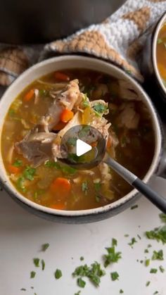 two bowls filled with soup on top of a table