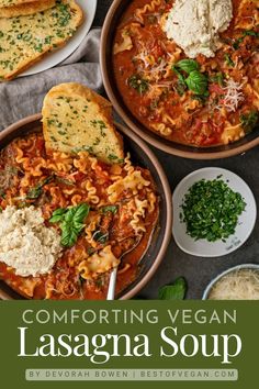 two bowls of lasagna soup with bread and parmesan cheese on the side