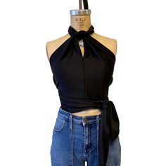 This 1970s glam halter tie top is perfect for clubbing or the holiday season.  Just throw on your favorite pair of jeans and you are good to go.  This cool little top can be tied 4 different ways or maybe even more.  Beautifully made from a vintage pattern and featured in our selection of gorgeous stretch fabric.   We recommend that you hand wash your garment in cold water and lay flat to dry for a longer life. ------------------------------------------------------------------------------------- Halter Neck Top With Tie Back For Evening, Halter Neck Top With Tie Back For Party, Stretch Tie-back Top For Party, Stretch Tie Back Top For Party, Chic Tie-back Top For Night Out, Chic Tie-back Halter Top For Date Night, Chic Tie Back Halter Top For Date Night, Chic Halter Top With Tie Back For Date Night, Evening Halter Neck Crop Top With Tie Back