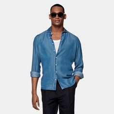 This casual blue shirt is tailored to an extra slim fit and features a small widespread collar, which gives it a more relaxed touch. Blue Slim Fit Button-up Shirt, Light Blue Casual Dress Shirt For Business Casual, Light Blue Casual Dress Shirt For Business, Denim Blue Slim Fit Button-up Top, Slim Fit Denim Blue Button-up Top, Slim Fit Light Blue Collared Shirt, Light Blue Slim Fit Shirt For Business Casual, Light Blue Slim Fit Collared Shirt, Fitted Light Blue Shirt For Business Casual